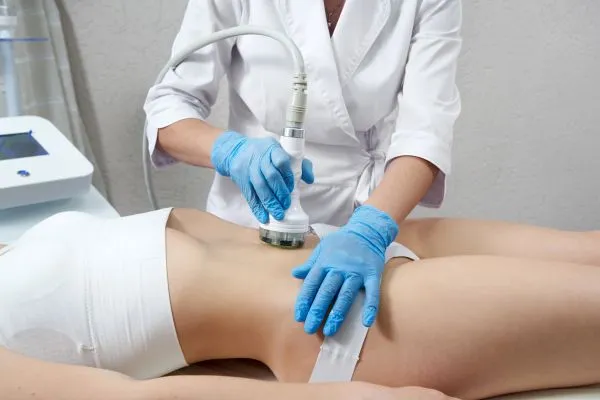 Lost the Weight but Not the Loose Skin? 2 woman having HIFU treatment on her stomach to combat loose skin Wibsey following weight loss